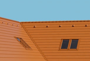 a bird is perched on the roof of a building