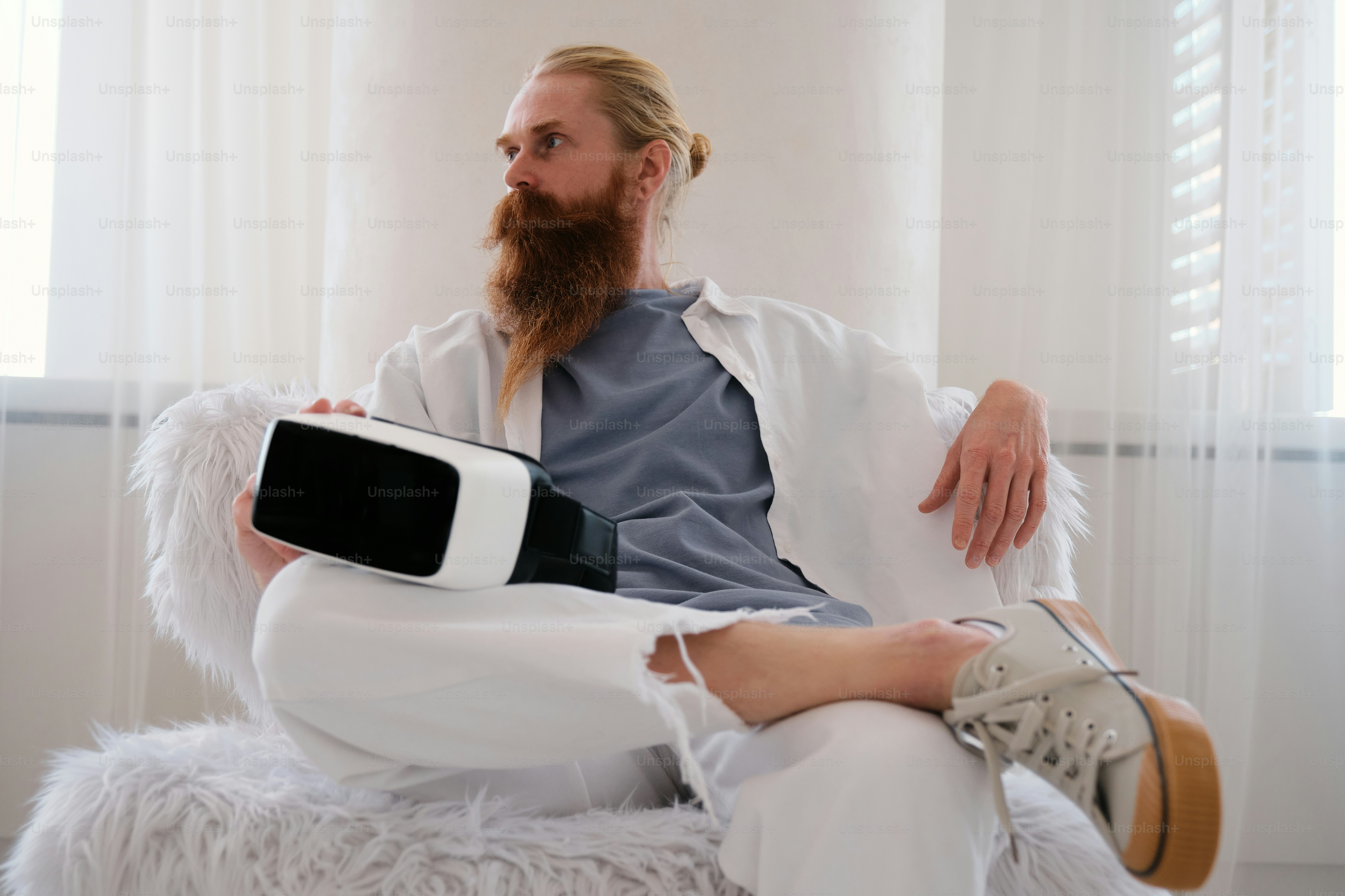 studio portrait of a man with VR headset