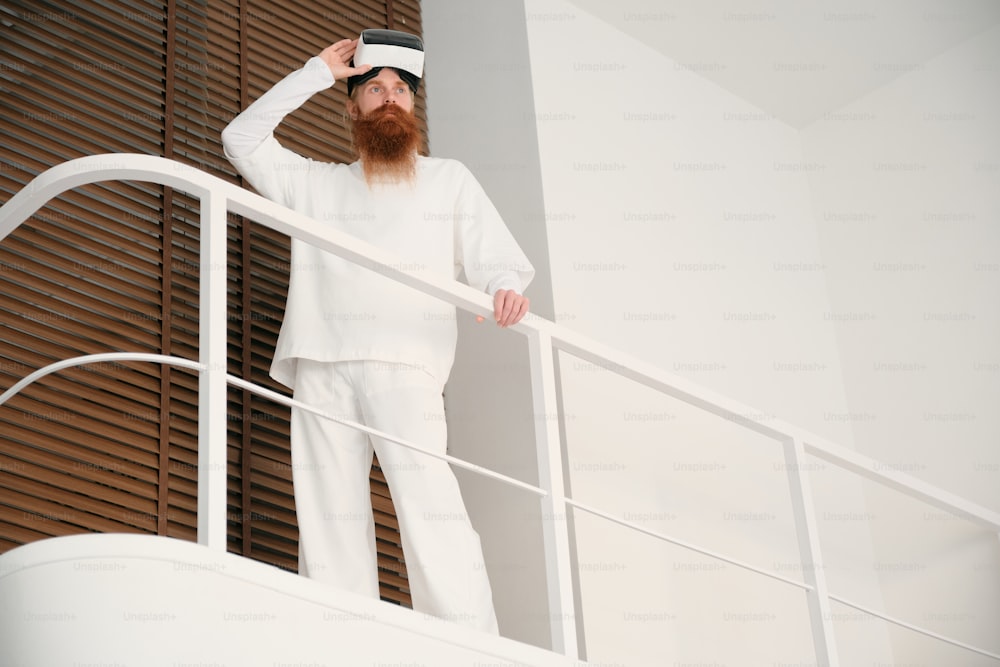 a man with a red beard wearing a white outfit
