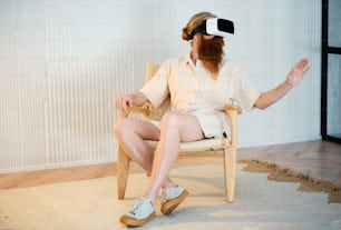 a man sitting in a chair with a pair of virtual glasses on his head