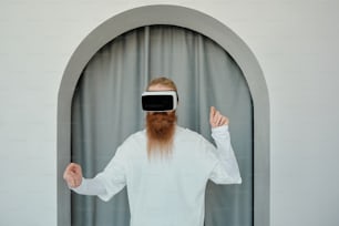 a man with a long beard wearing a blindfold
