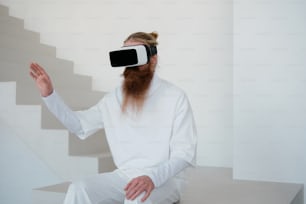 a man with a beard wearing a virtual reality headset