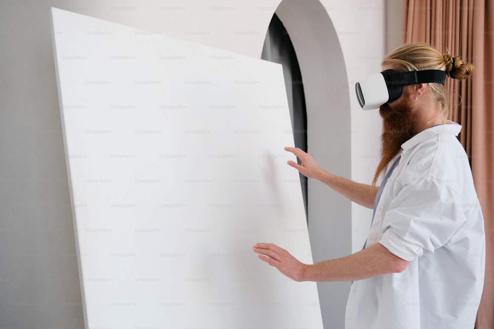 a man in a white lab coat is using a virtual reality device