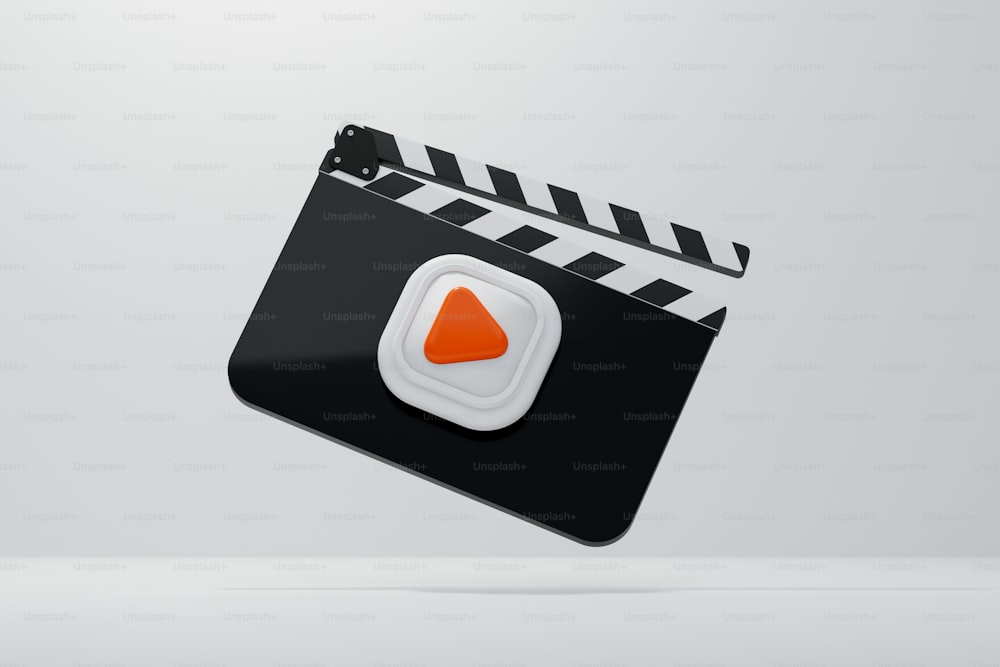 a movie clapper with an orange triangle on it