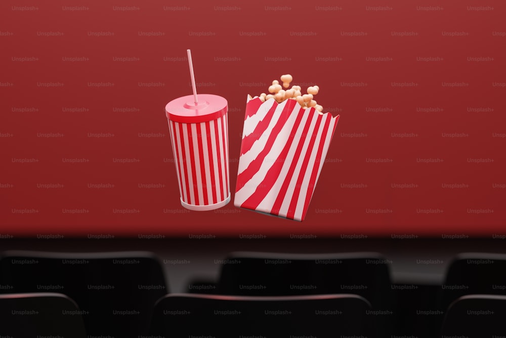 a red and white striped bag of popcorn and a red and white striped bag of