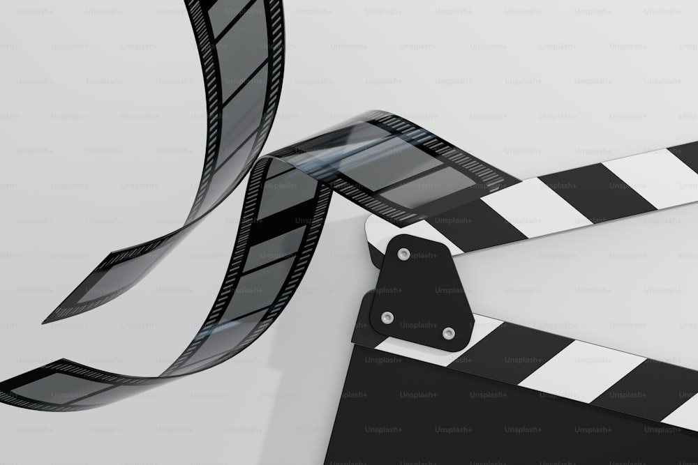 a black and white film strip and a black and white clapper