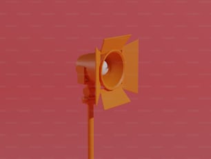 a yellow traffic light with a red background