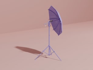 Un paraguas morado está sobre un trípode azul