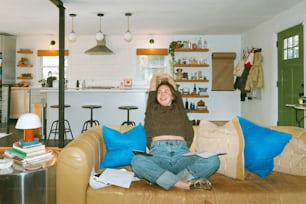 a woman sitting on a couch in a living room