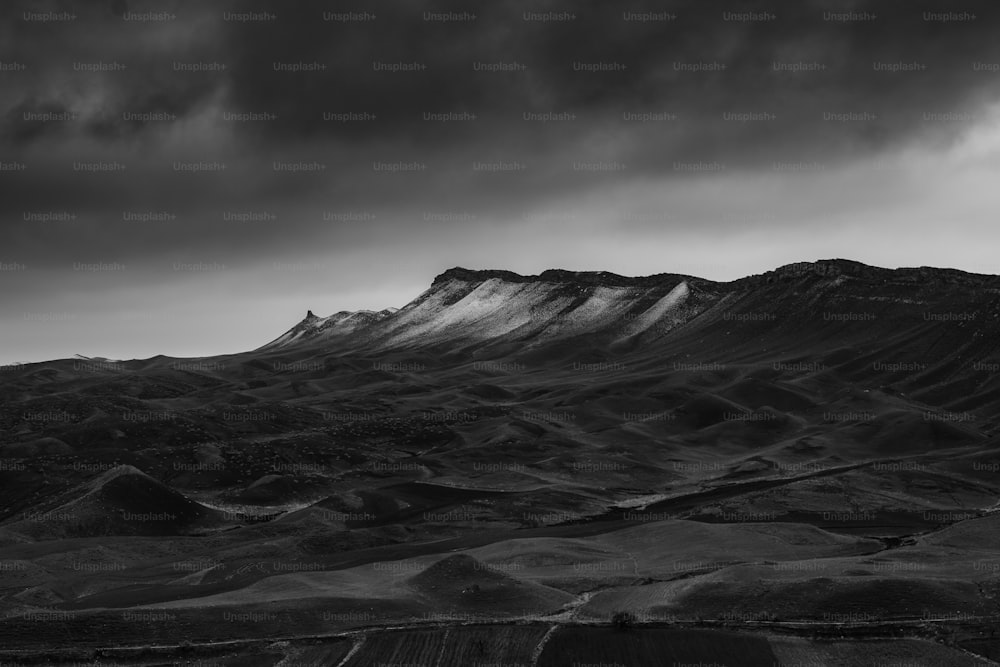 a black and white photo of a mountain range