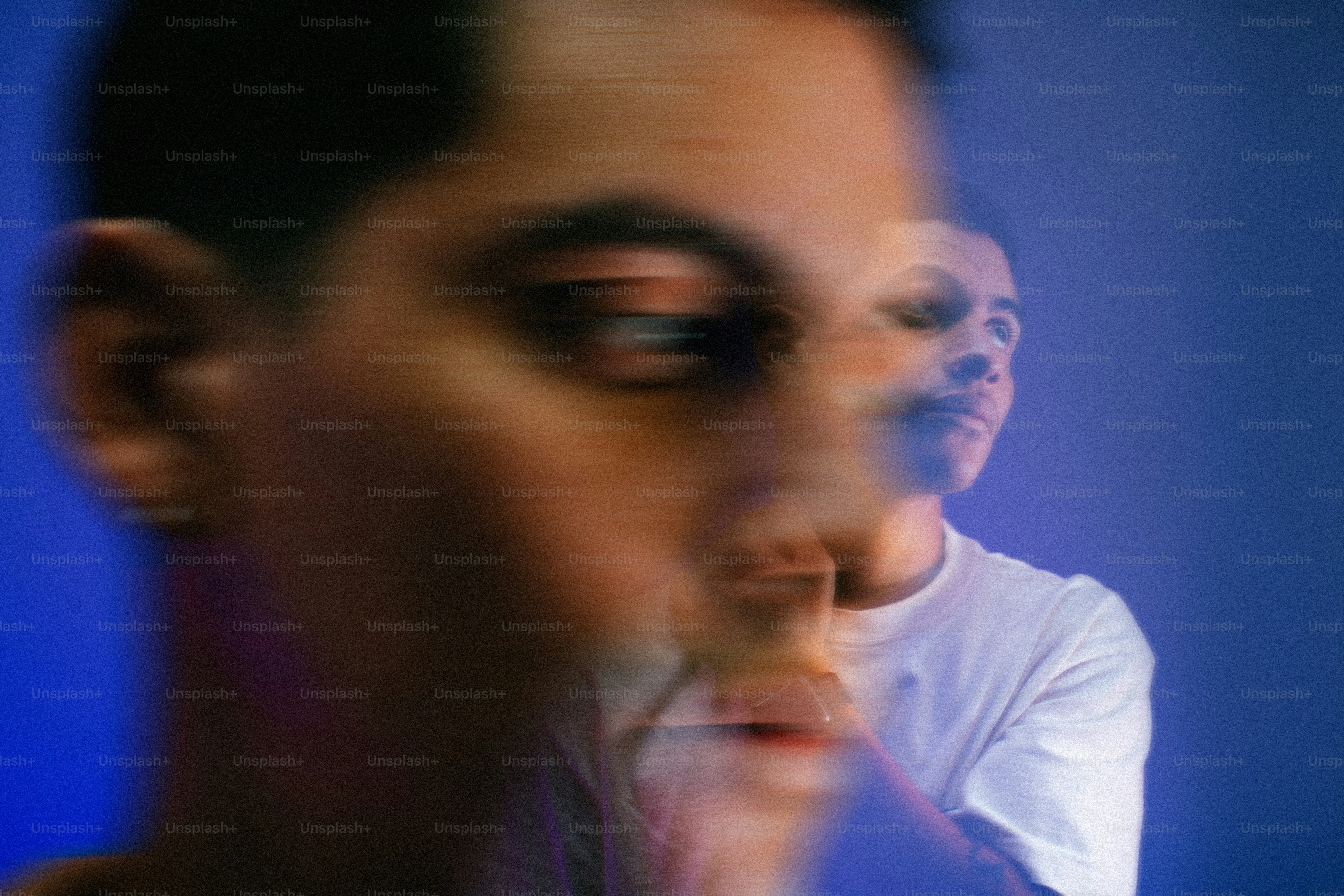 a blurry photo of a man brushing his teeth