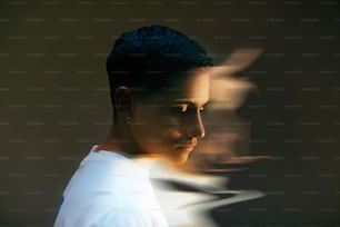 a man in a white shirt with a blurry background