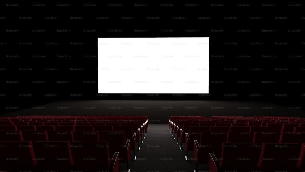 an empty theater with rows of red seats