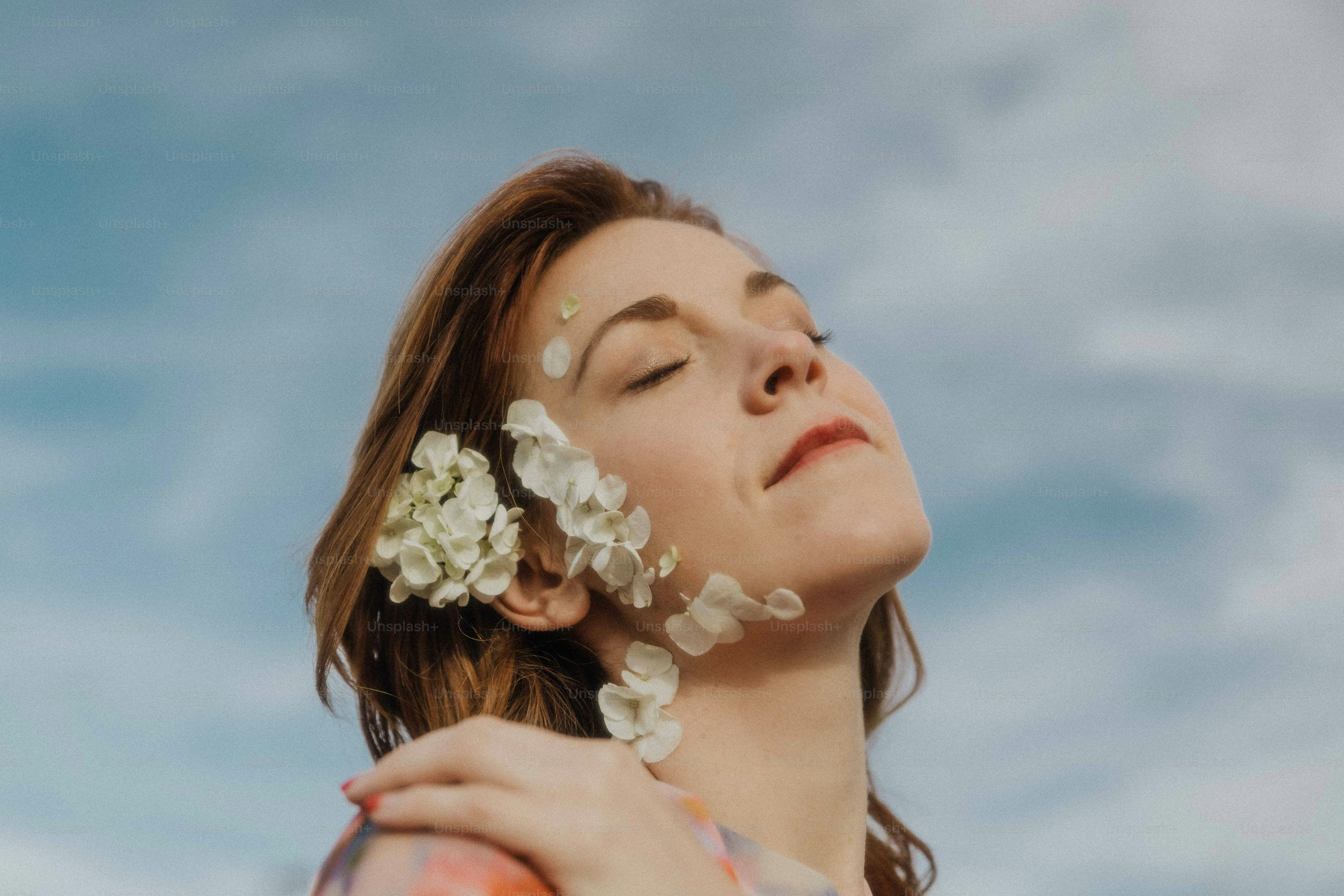 a woman with a flower in her hair