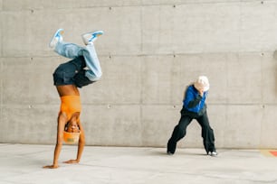 a person doing a handstand on a skateboard