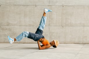 a man is doing a handstand on his stomach