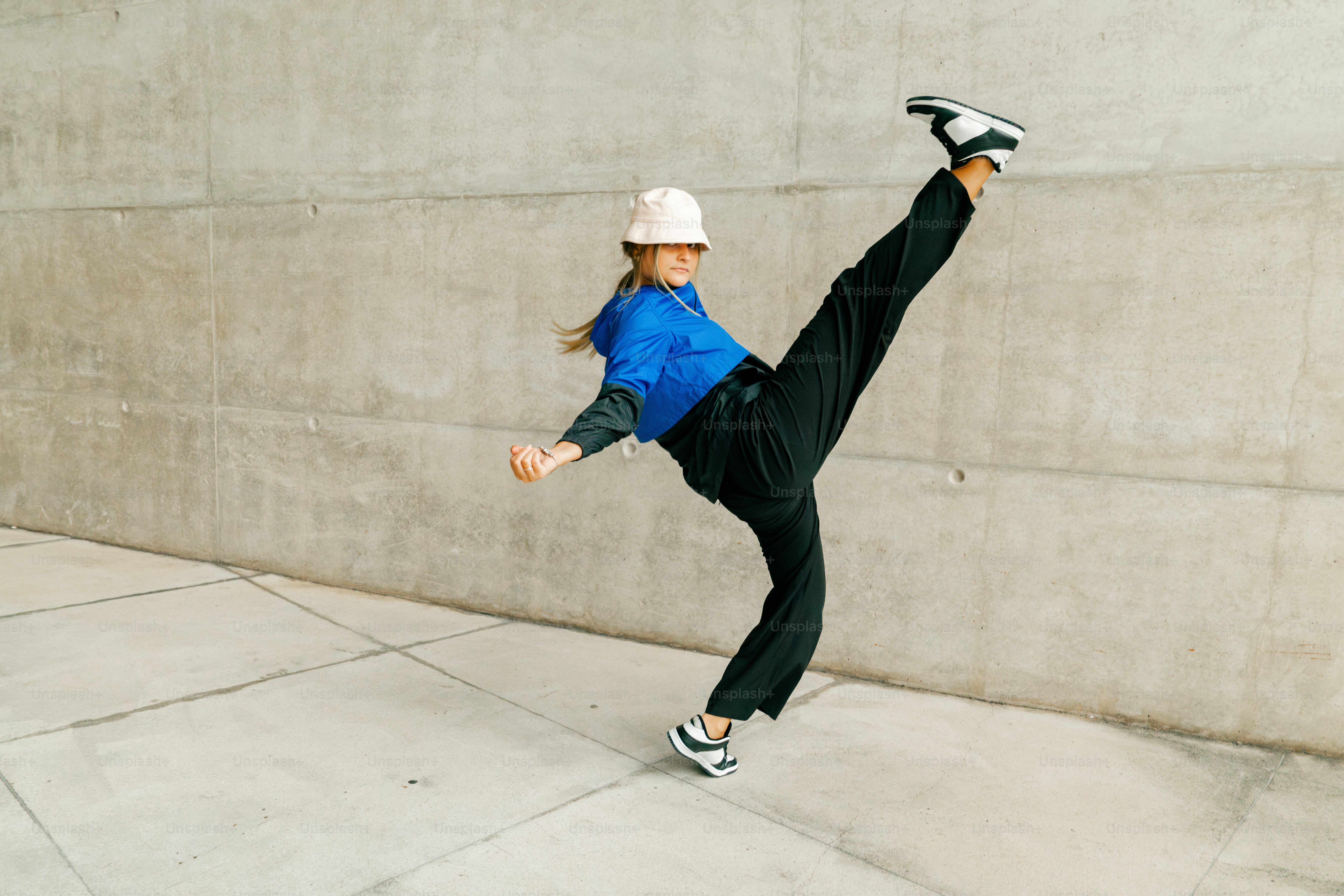 a woman is doing a trick on a skateboard