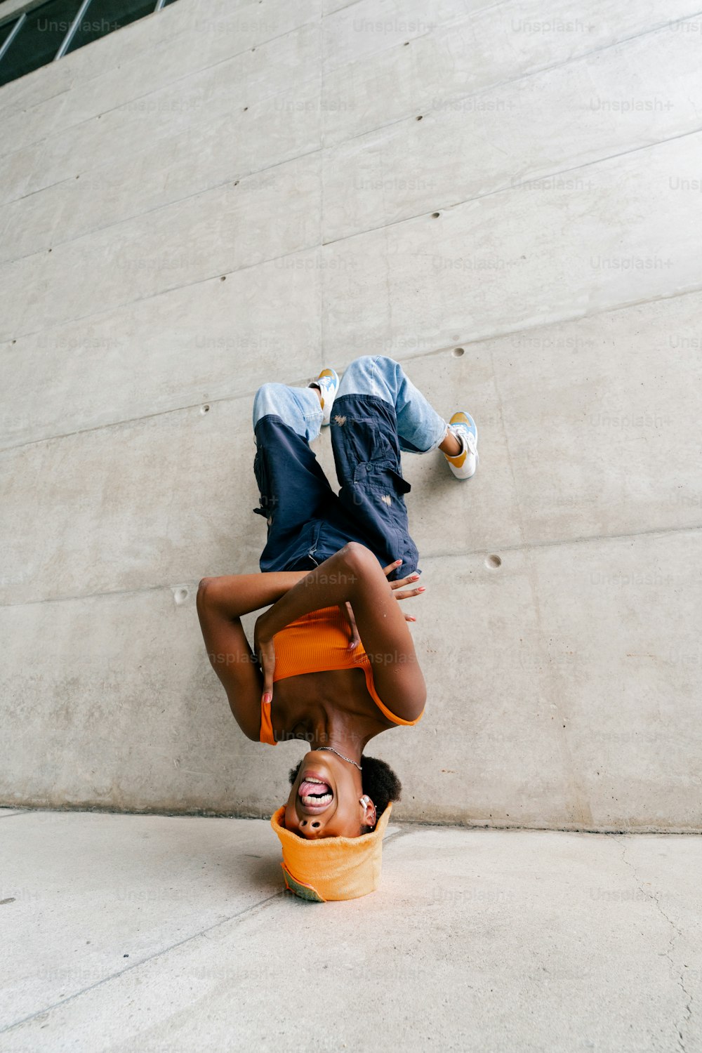 a person upside down on a skateboard
