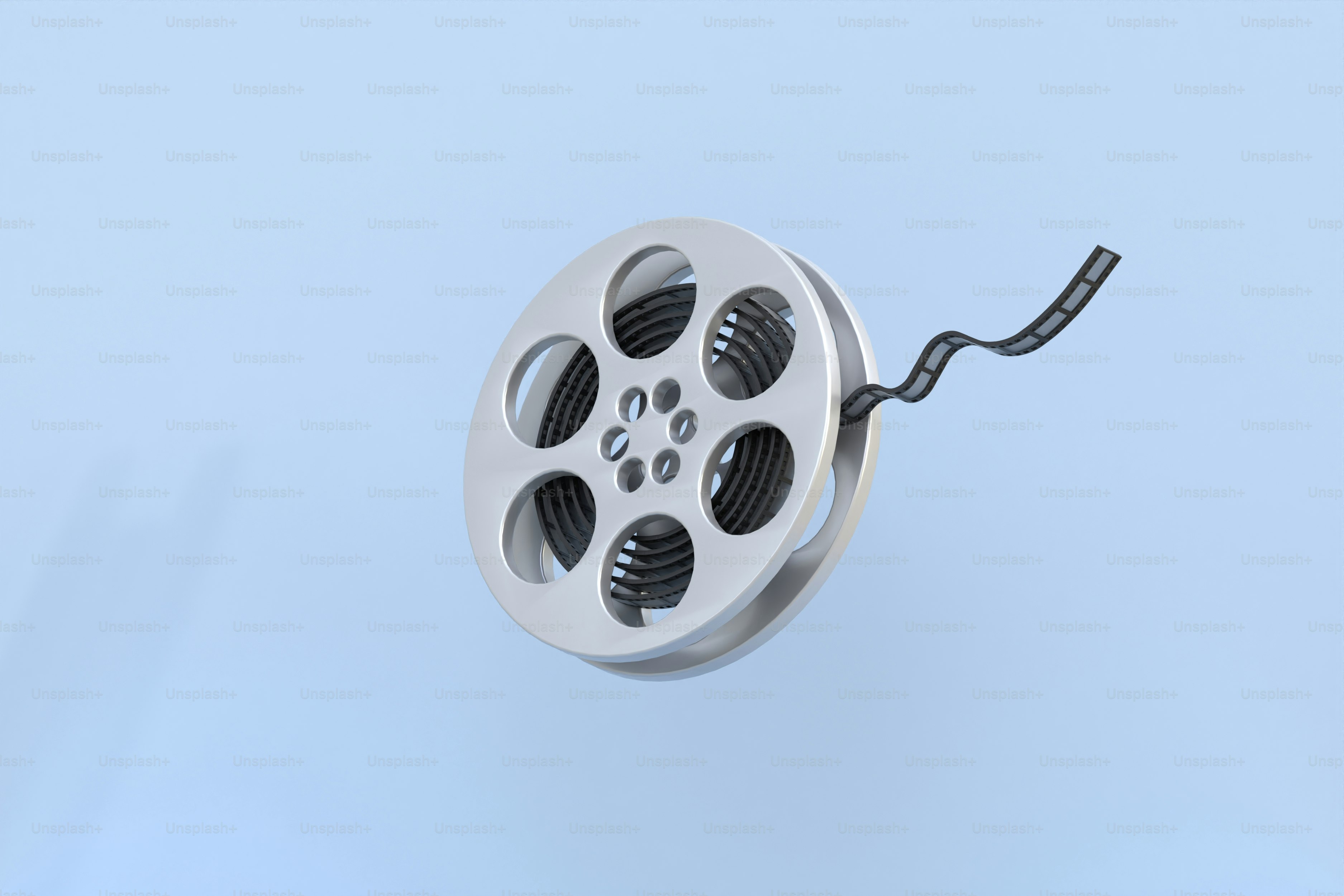 ein Metallgegenstand, an dem eine schwarze Schnur befestigt ist