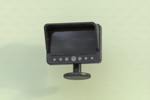 a computer monitor mounted to the side of a wall