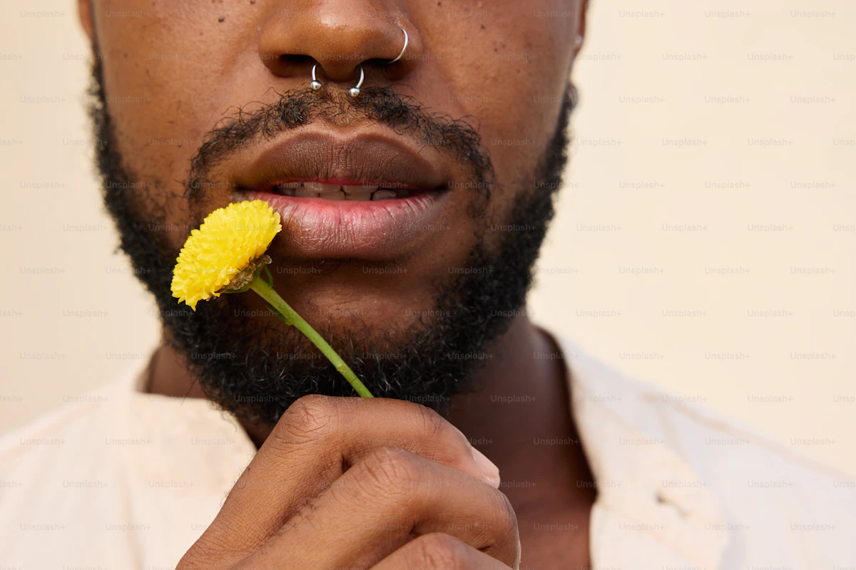 Septum piercing with a yellow flower