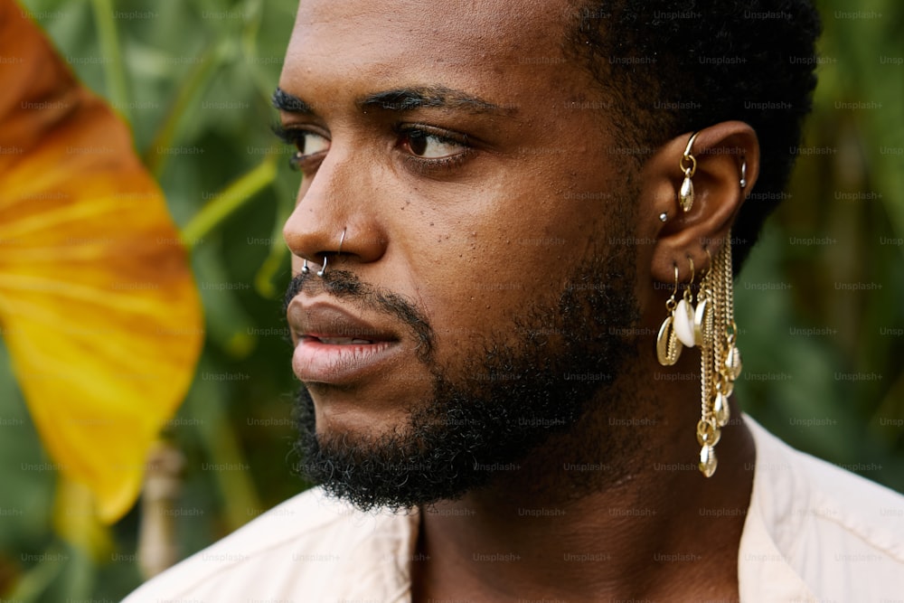 a close up of a person wearing ear rings