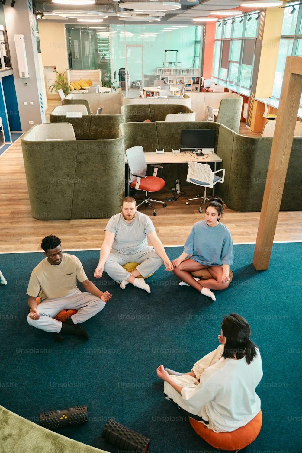 a group of people sitting on the floor in a circle