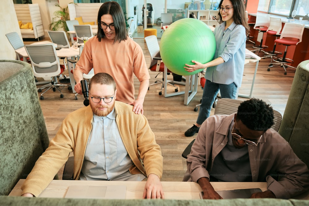 a group of people standing around a room