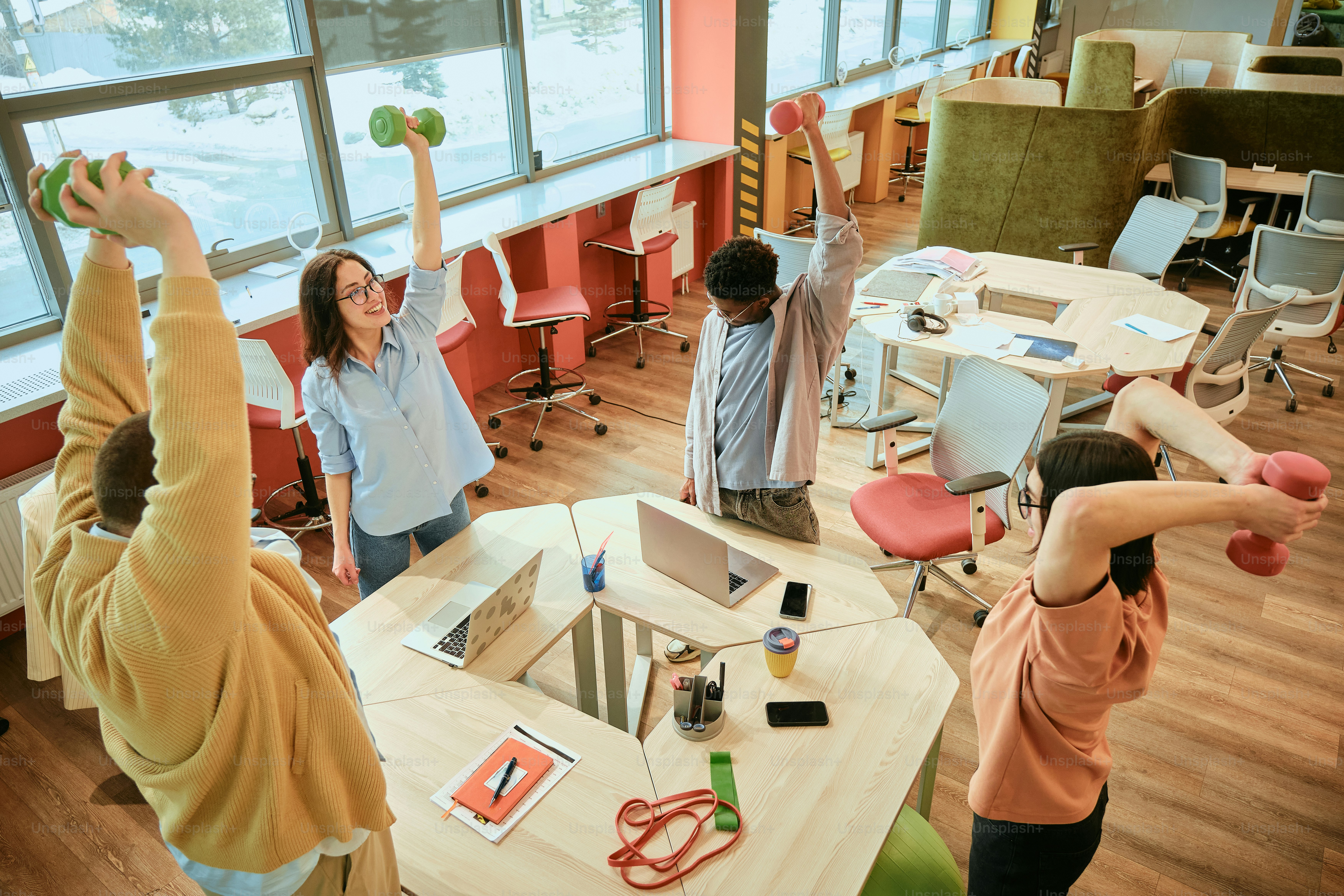 a group of people standing around a room