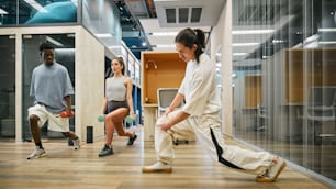 a group of people in a room playing with a frisbee