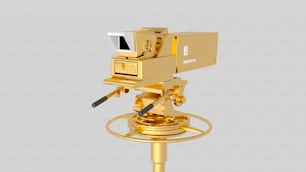 a gold object with a camera on top of it