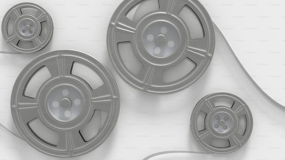 three reels of film on a white background