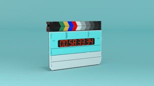 a digital clock with a film strip on top of it