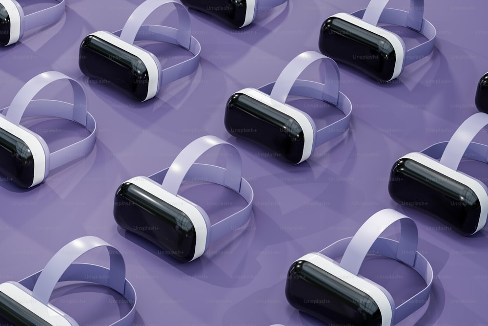 a group of virtual reality headsets sitting on top of a purple surface