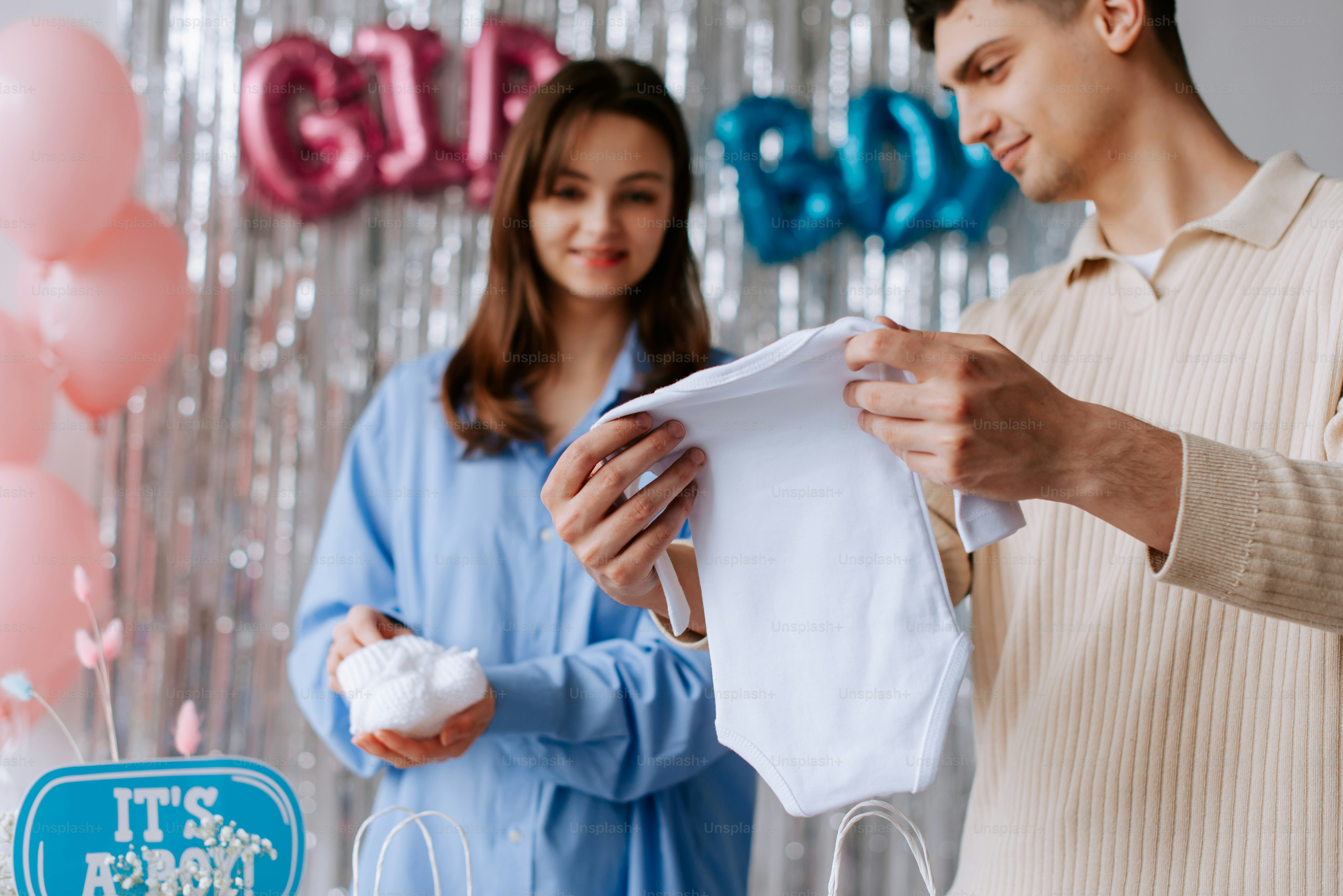 a man and woman standing in front of a cake