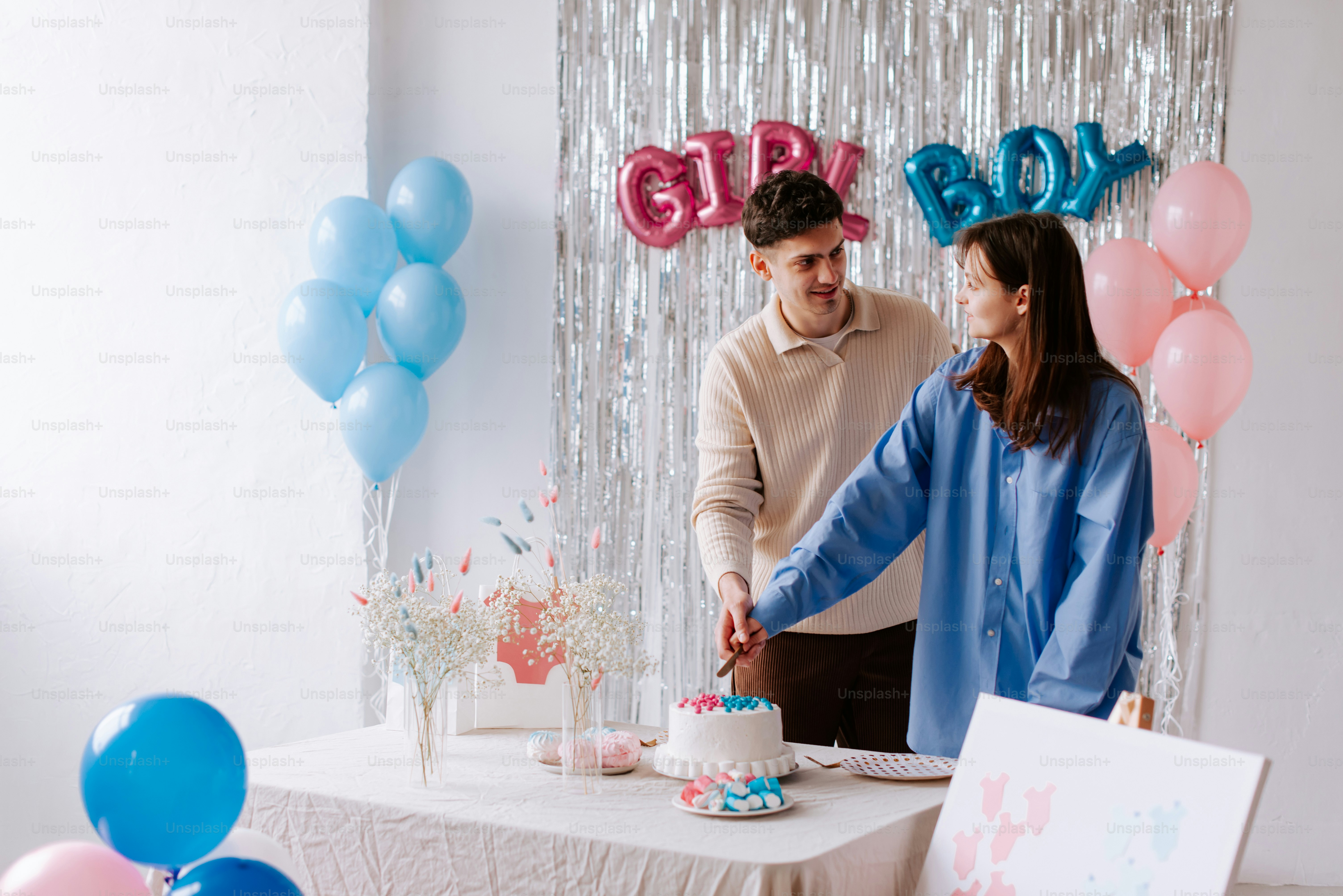 a man and woman cutting a cake together