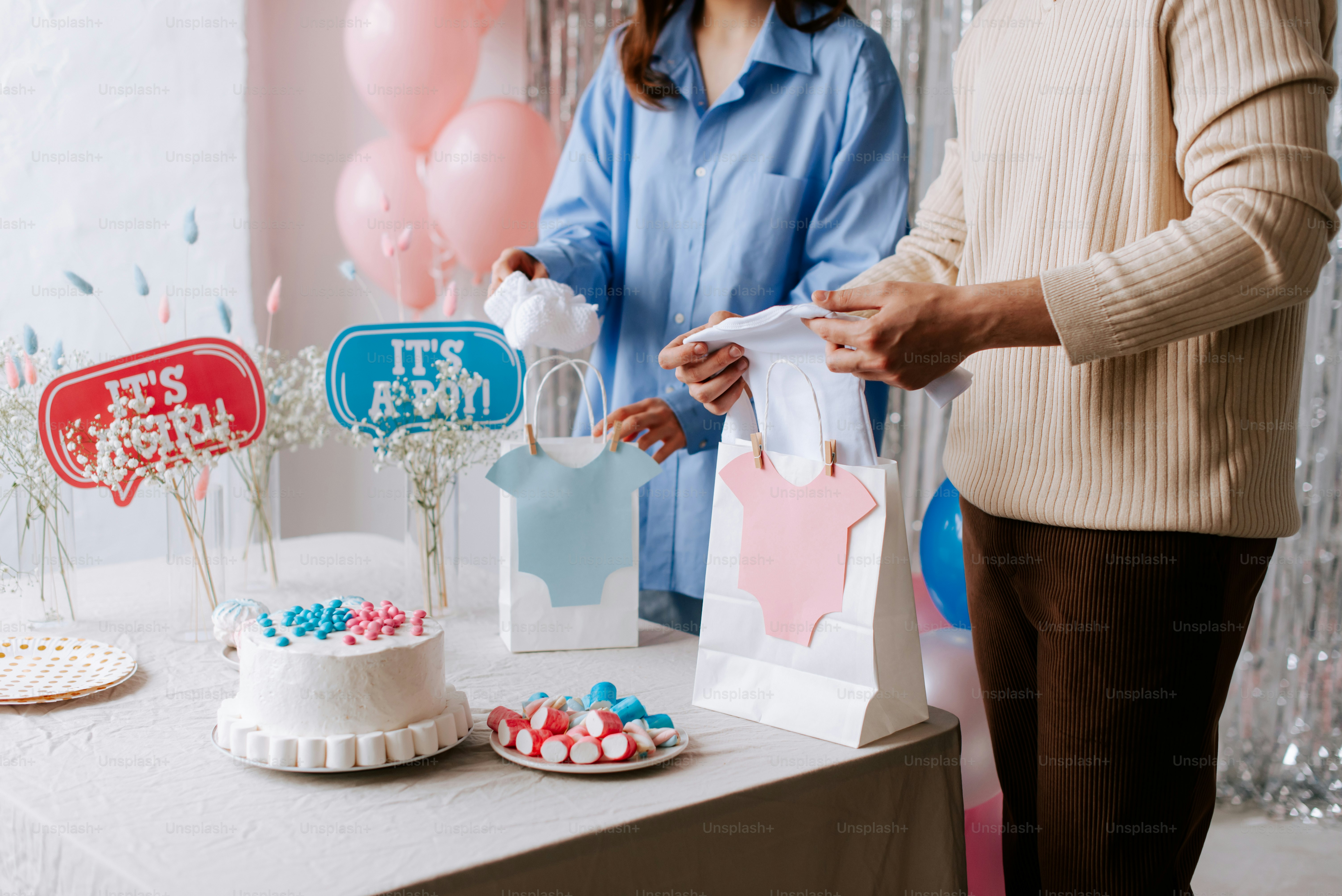 a woman standing next to a table with a cake on it