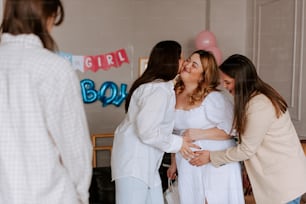 a group of women standing next to each other