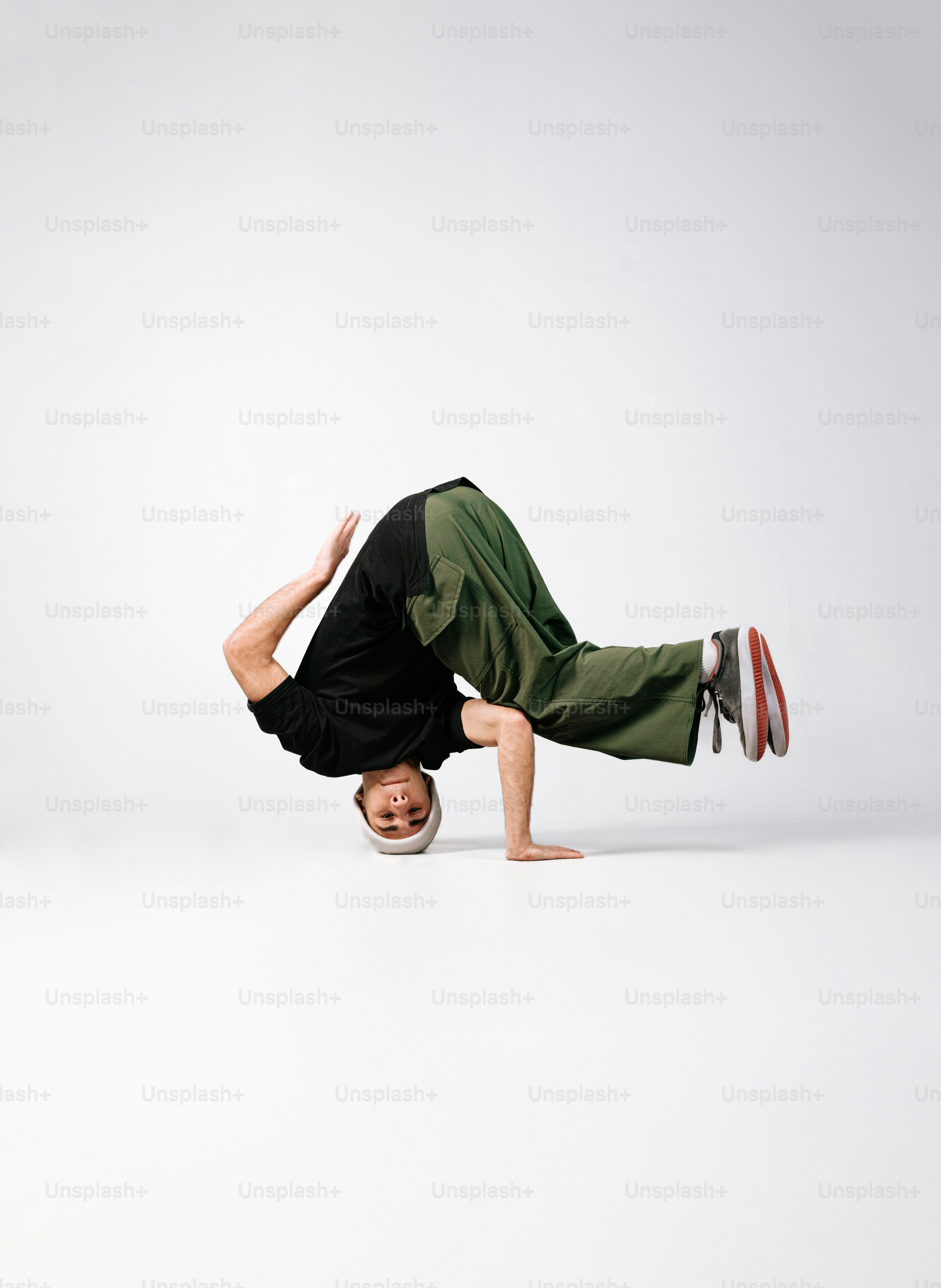 a man is doing a handstand on his head