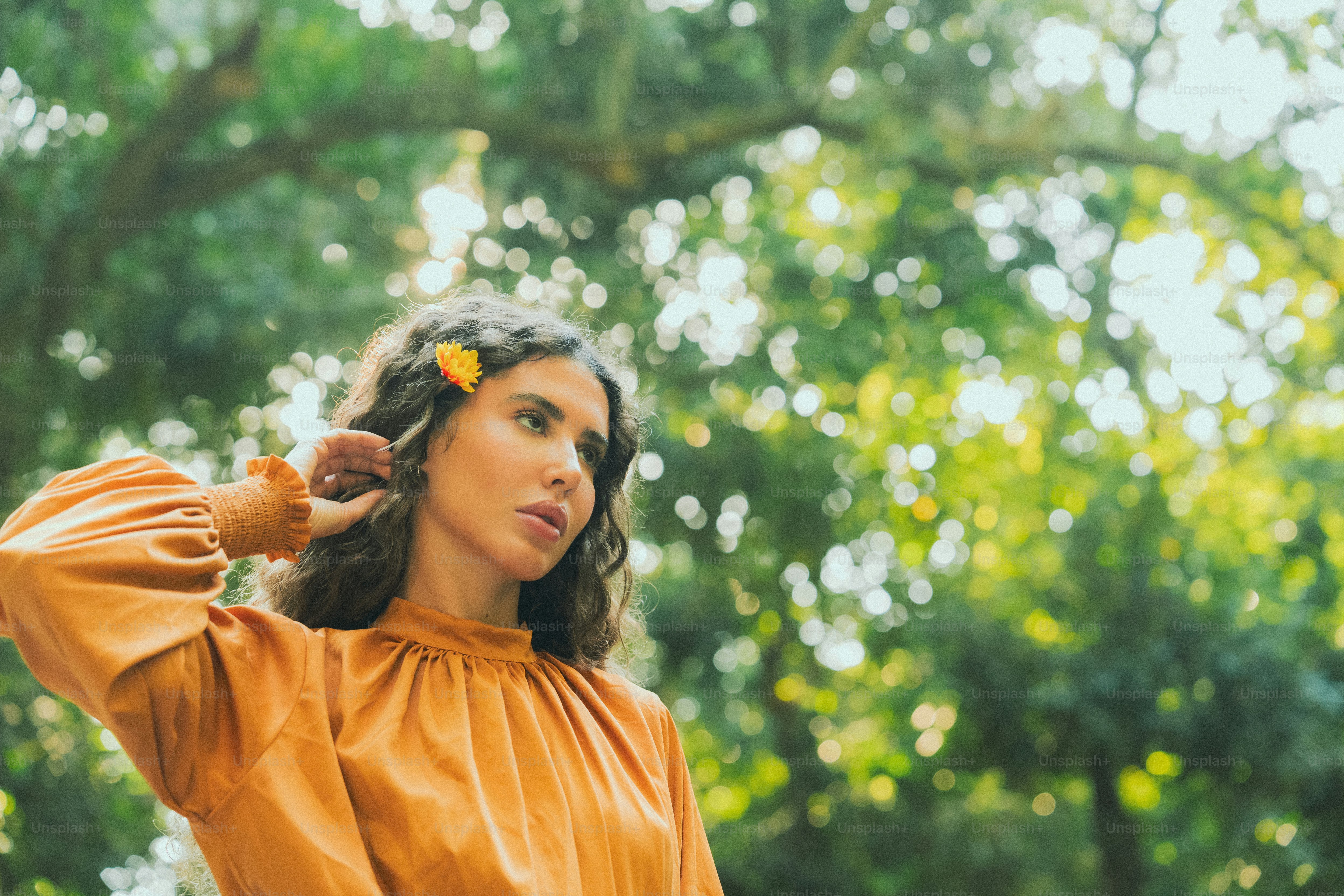 A woman with a flower in her hair photo – Spring Image on Unsplash