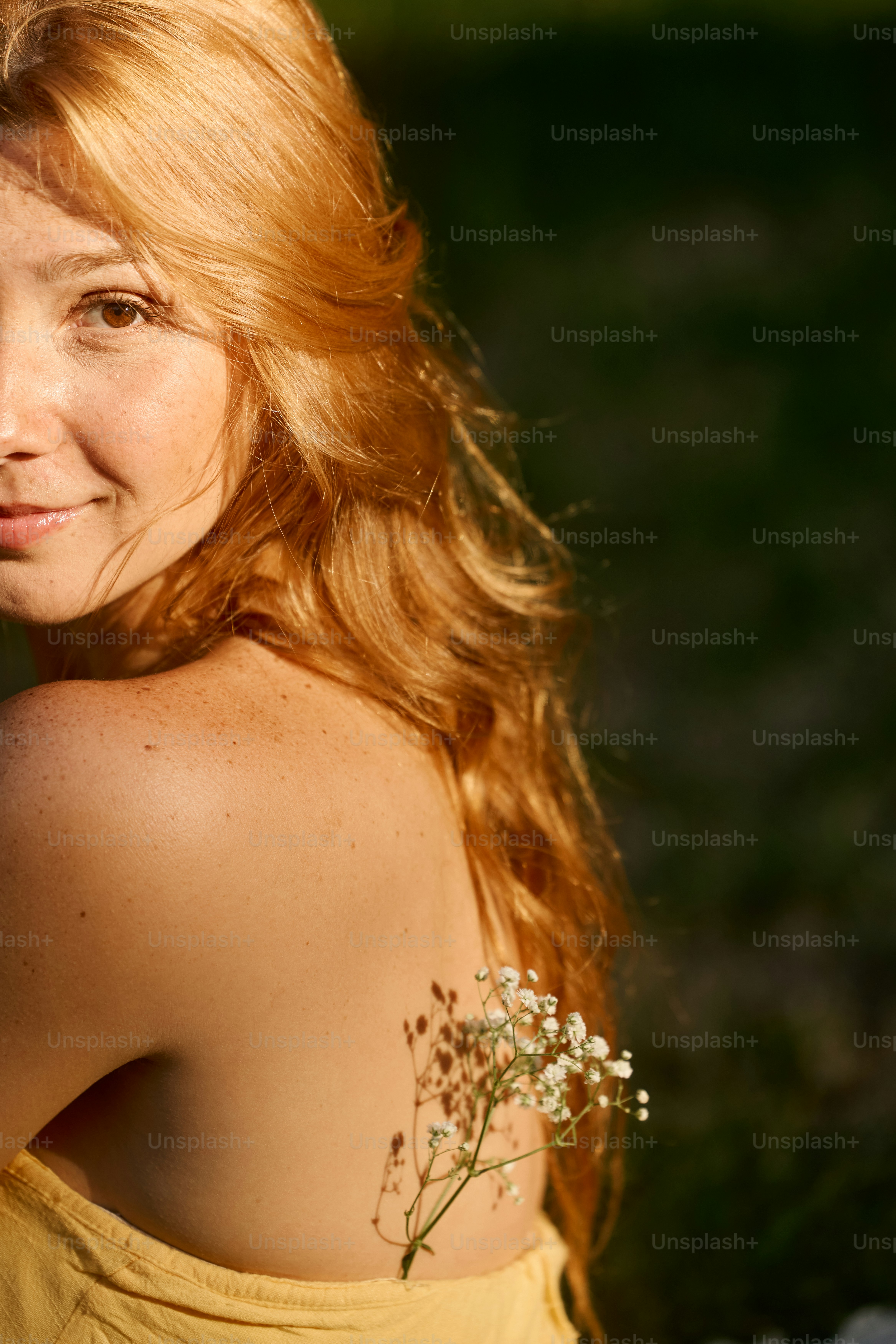 A woman in a yellow dress holding red flowers photo – Flowers Image on ...