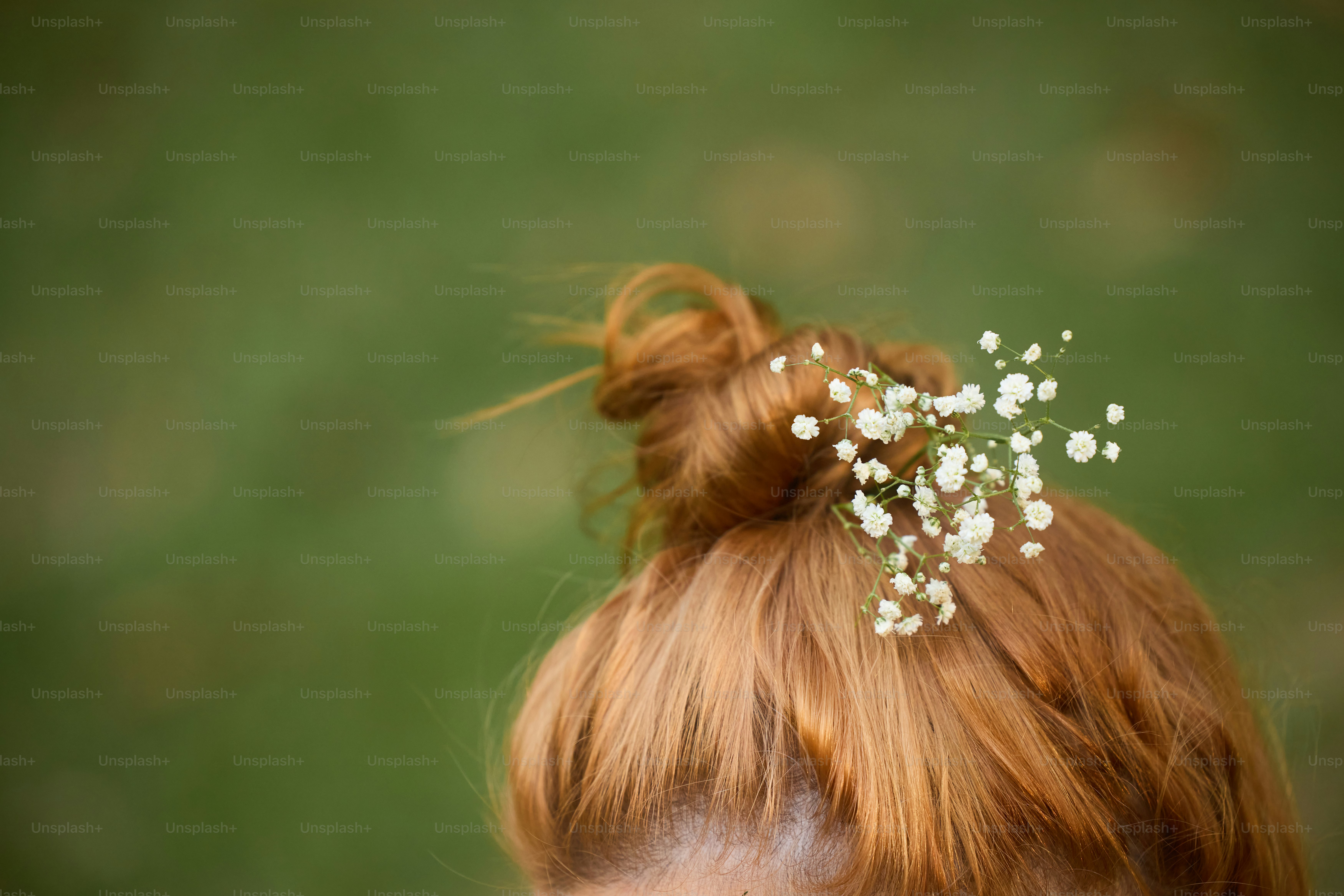 A close up of a woman with a flower in her hair photo – Woman Image on ...