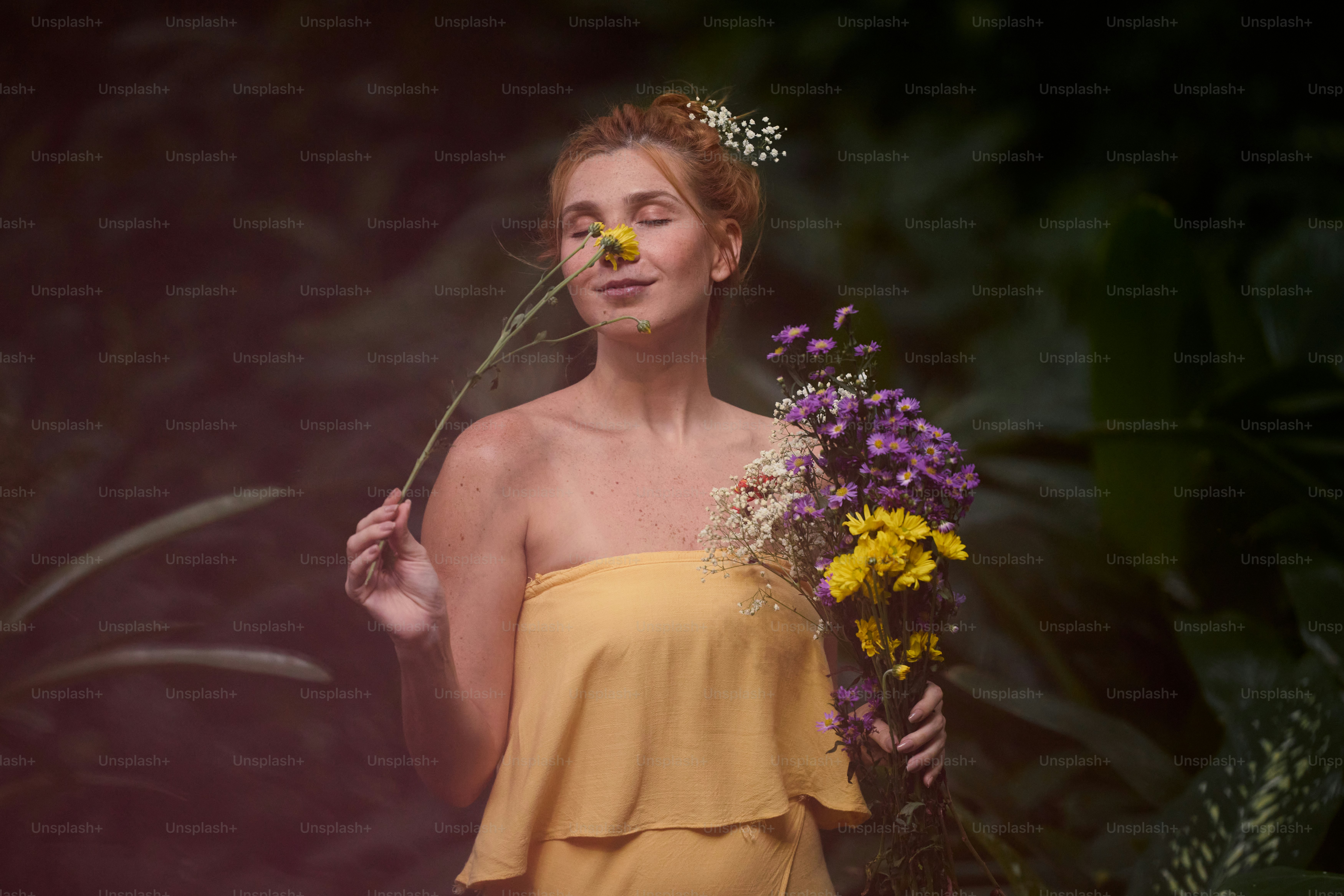 A woman in a yellow dress holding a bunch of flowers photo – Flowers ...