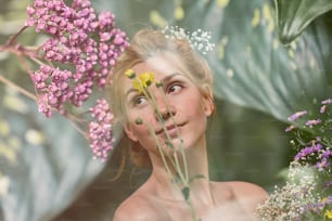 a woman with a wreath of flowers in her hair