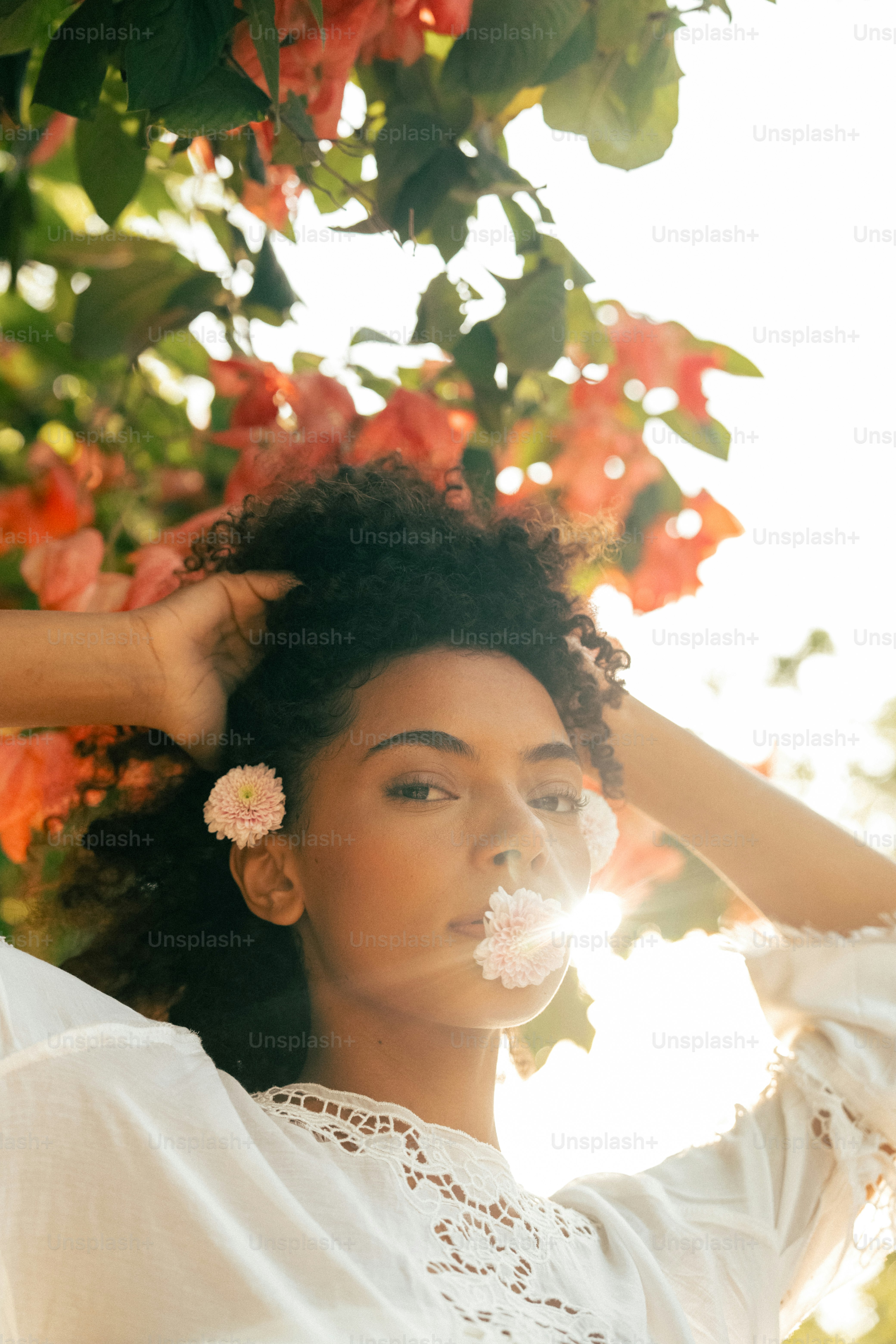 a woman with a flower in her hair