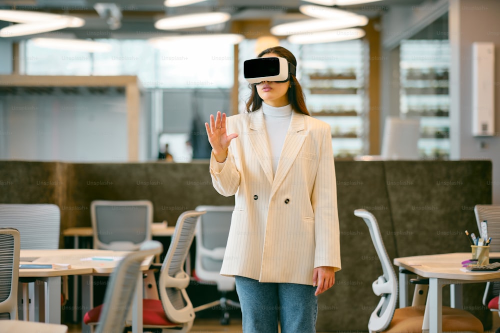 a woman wearing a suit and a virtual headset