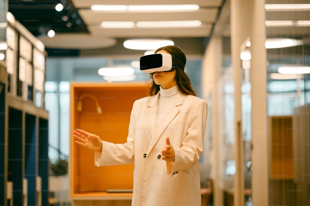 a woman in a white coat wearing a virtual headset