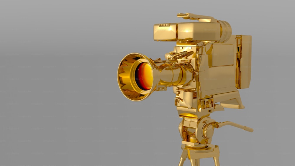 um objeto dourado com uma grande lente em cima dele