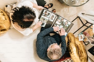 a man laying on the floor reading a magazine