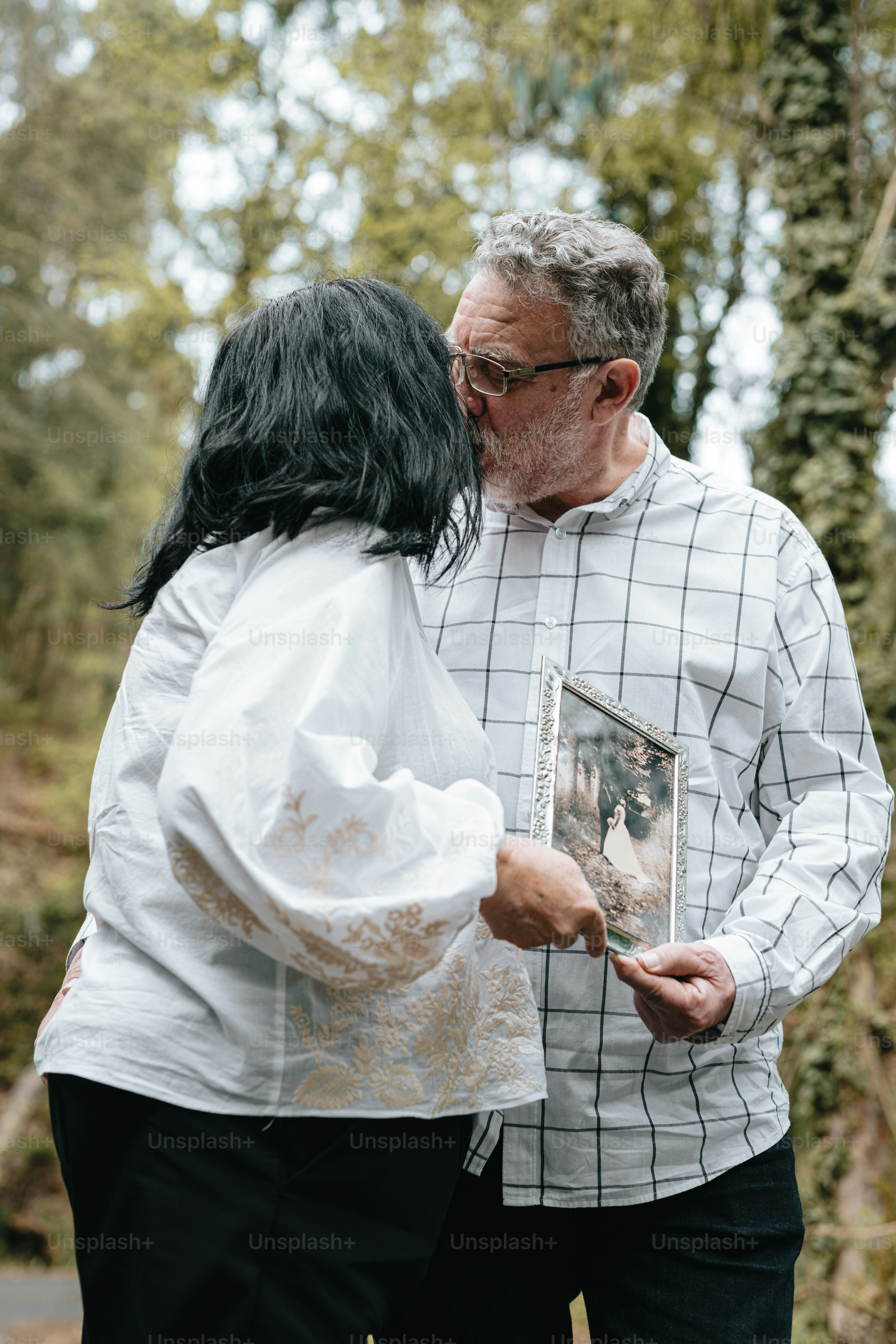 A man and a woman standing next to each other photo – Outdoor Image on ...
